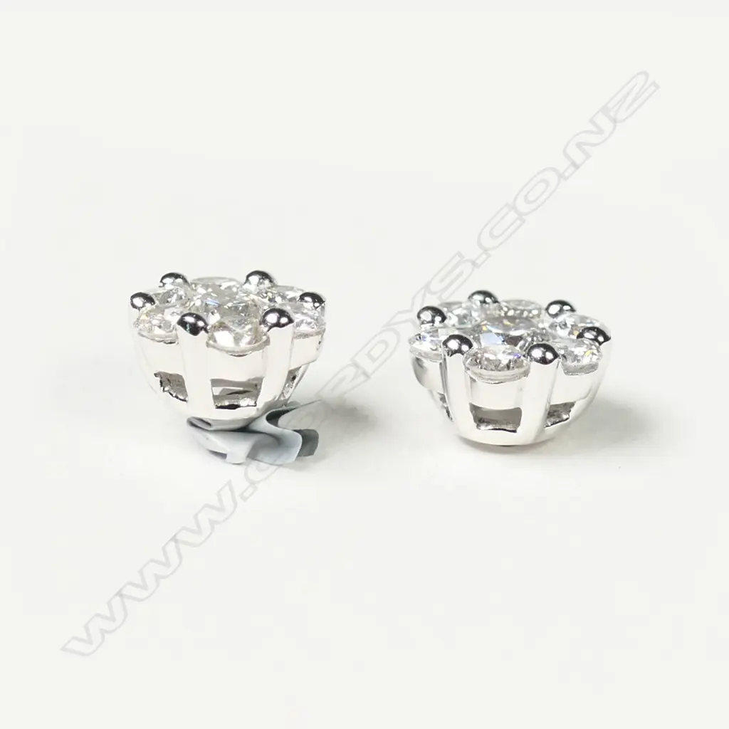 A pair of 18ct white gold and diamond cluster earrings Image 1++