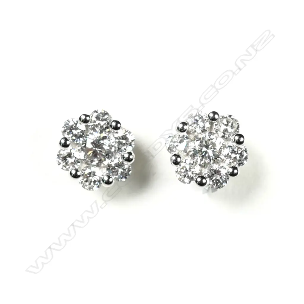 A pair of 18ct white gold and diamond cluster earrings Image 1++