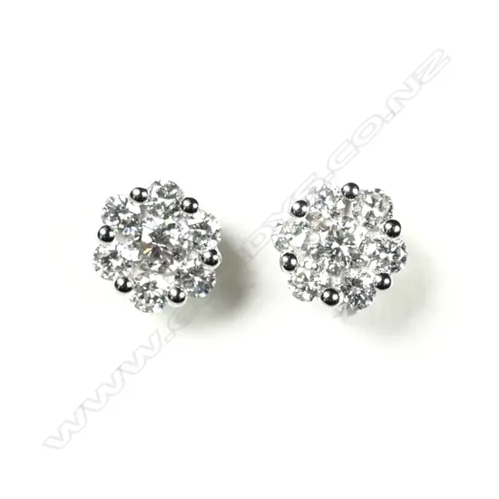 A pair of 18ct white gold and diamond cluster earrings