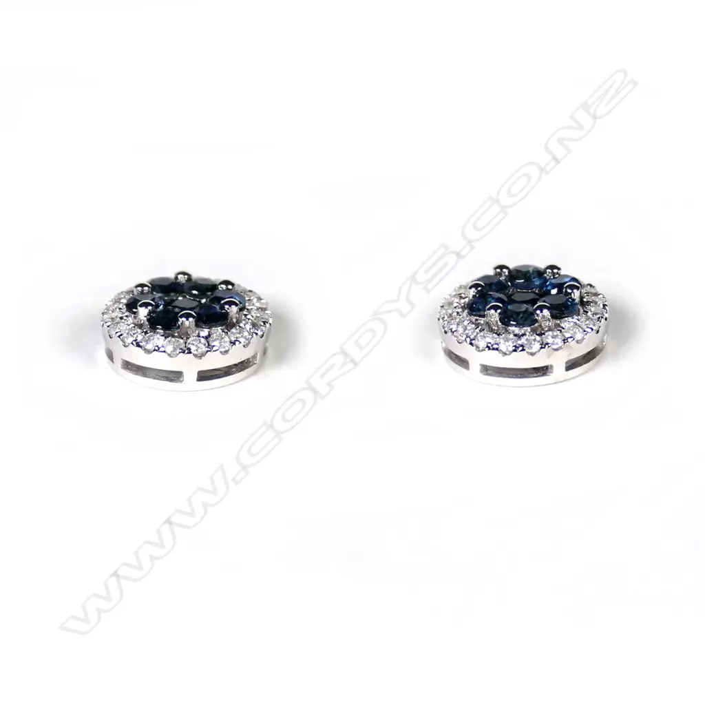 A pair of 14ct white gold sapphire and diamond stud earrings Image 1++