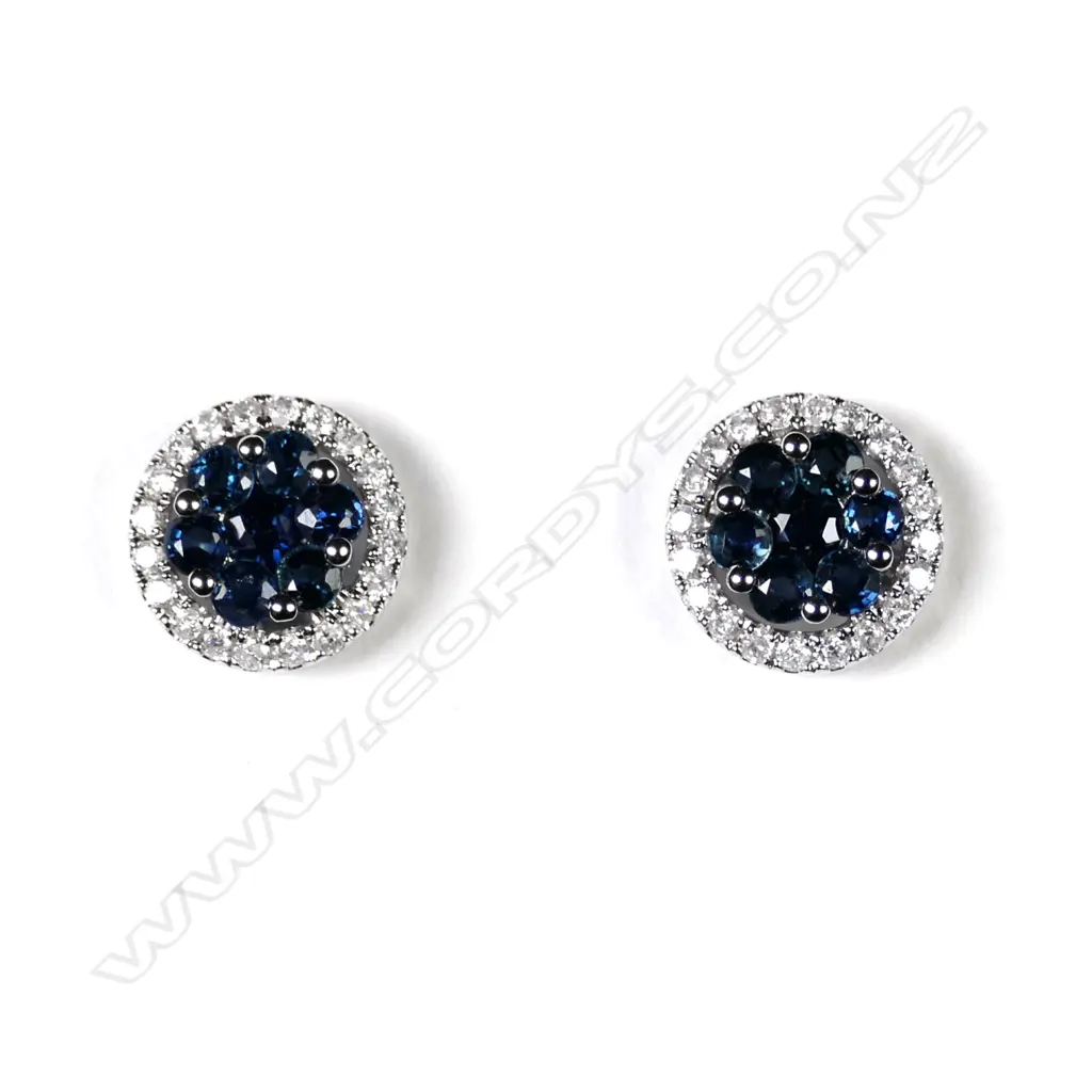 A pair of 14ct white gold sapphire and diamond stud earrings Image 1++