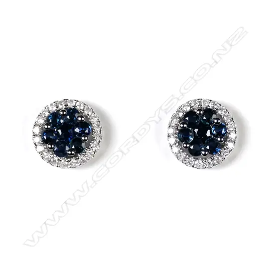A pair of 14ct white gold sapphire and diamond stud earrings