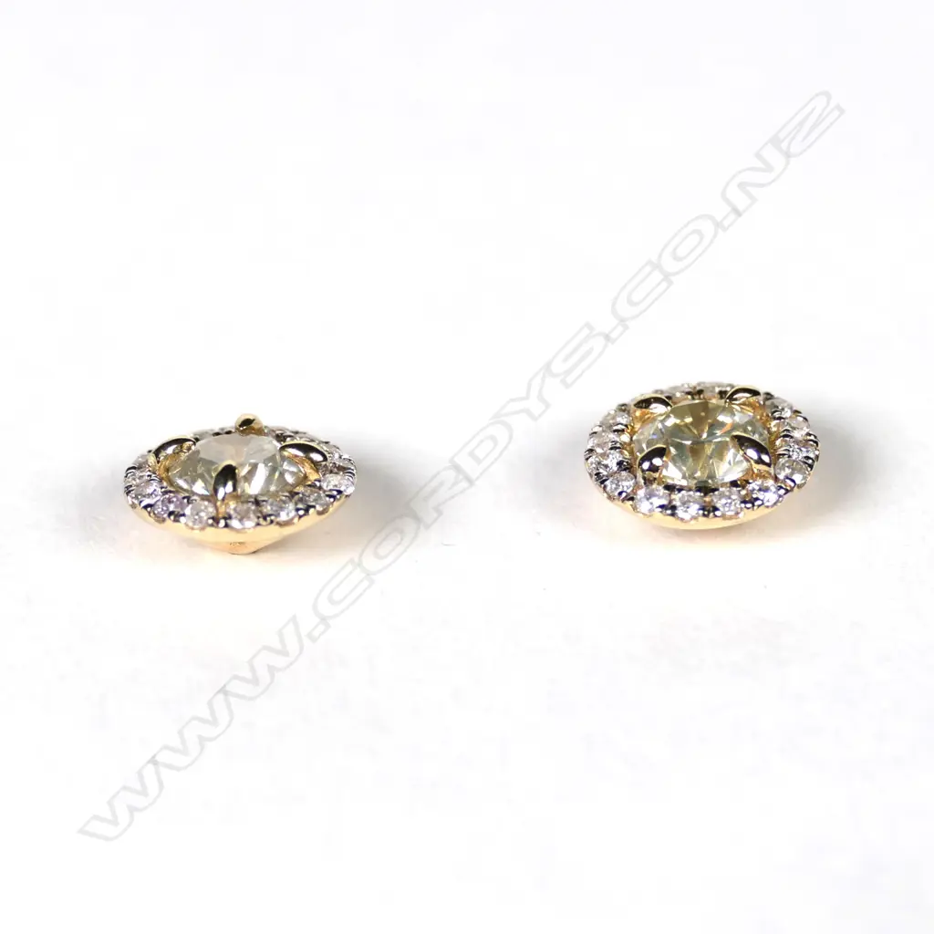 A pair of 14ct gold and diamond halo stud earrings Image 1++