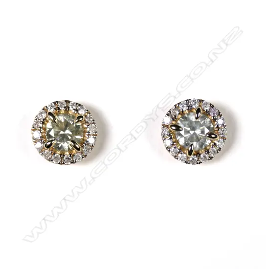 A pair of 14ct gold and diamond halo stud earrings