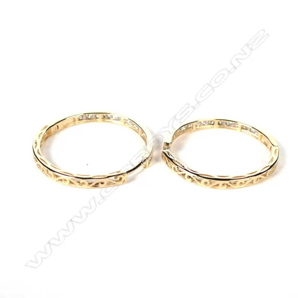 A pair of 14ct gold and diamond hoop earrings Image 1++