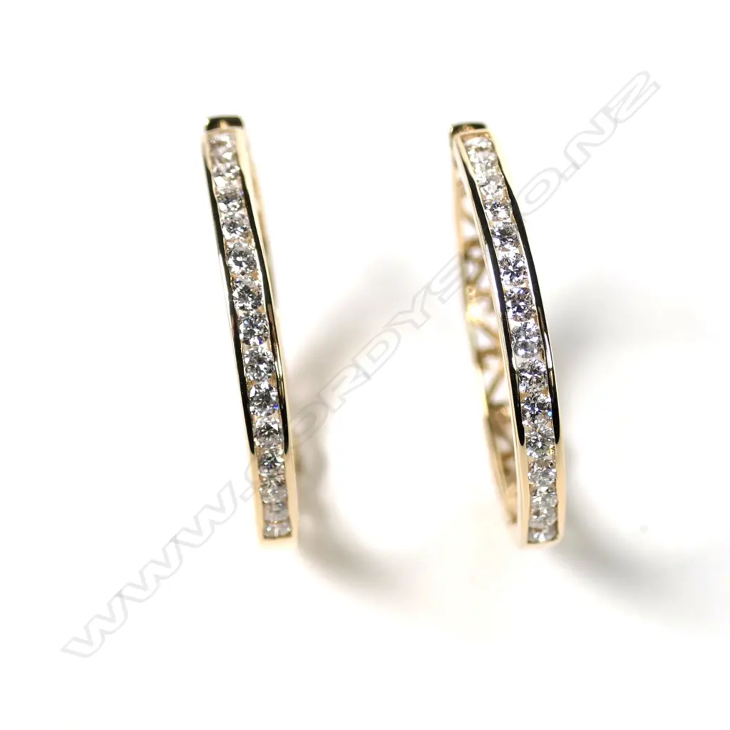 A pair of 14ct gold and diamond hoop earrings Image 1++