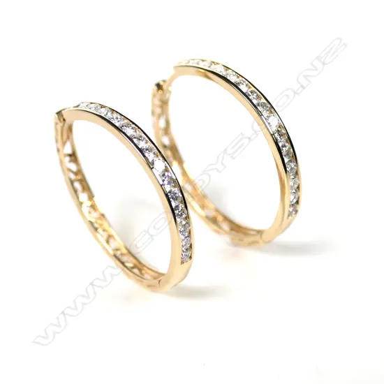 A pair of 14ct gold and diamond hoop earrings