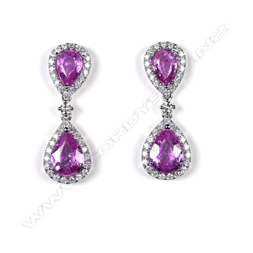 A pair of 14ct white gold sapphire and diamond drop earrings Image 1++