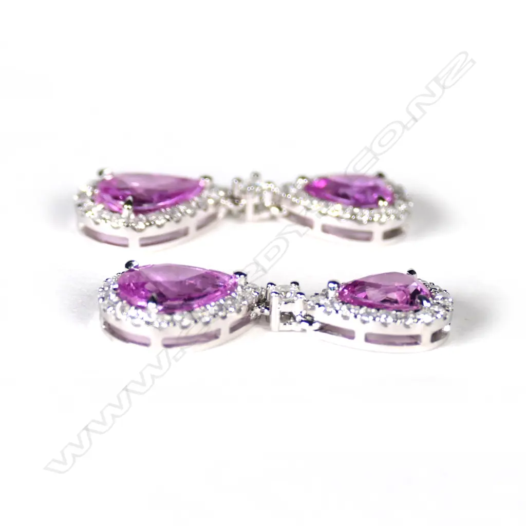 A pair of 14ct white gold sapphire and diamond drop earrings Image 1++