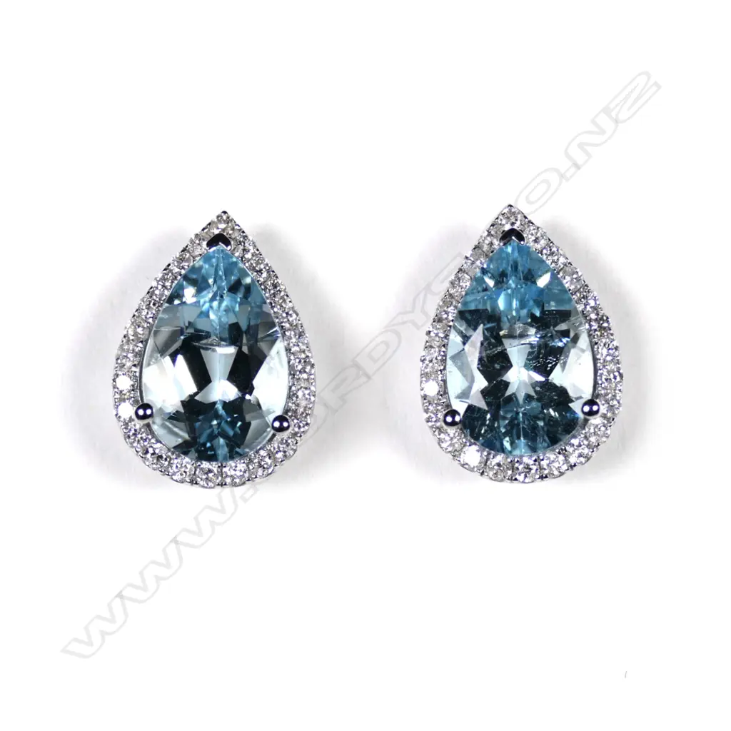 A pair of 14ct white gold aquamarine and diamond halo earrings Image 1++