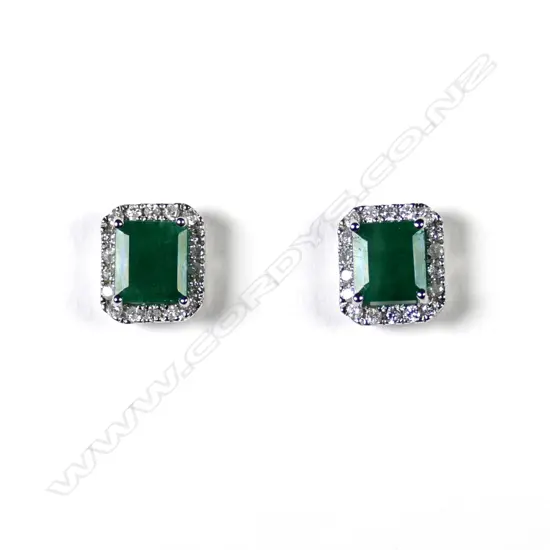 A pair of 14ct white gold emerald and diamond stud halo earrings