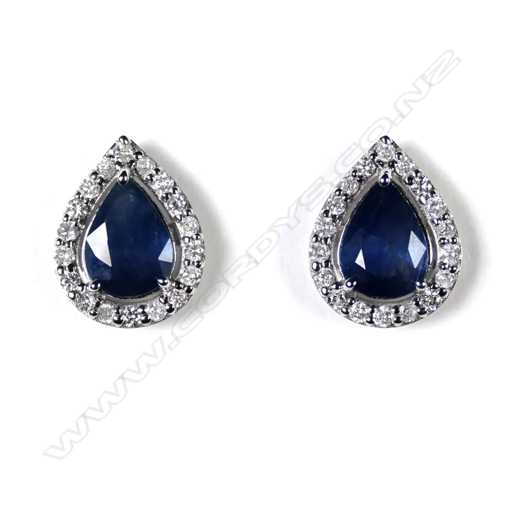 A pair of 14ct white gold sapphire and diamond stud halo earrings Image 1++