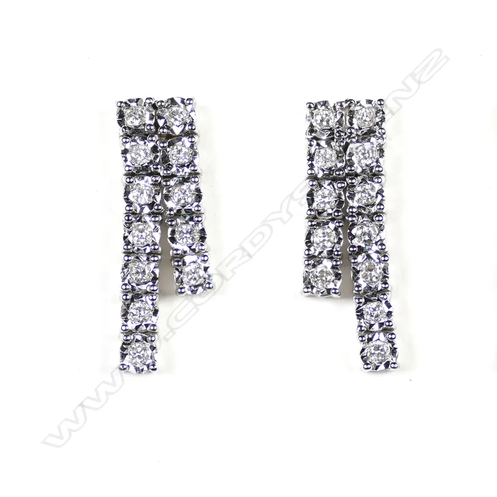 A pair of 14ct white gold and diamond earrings Image 1++