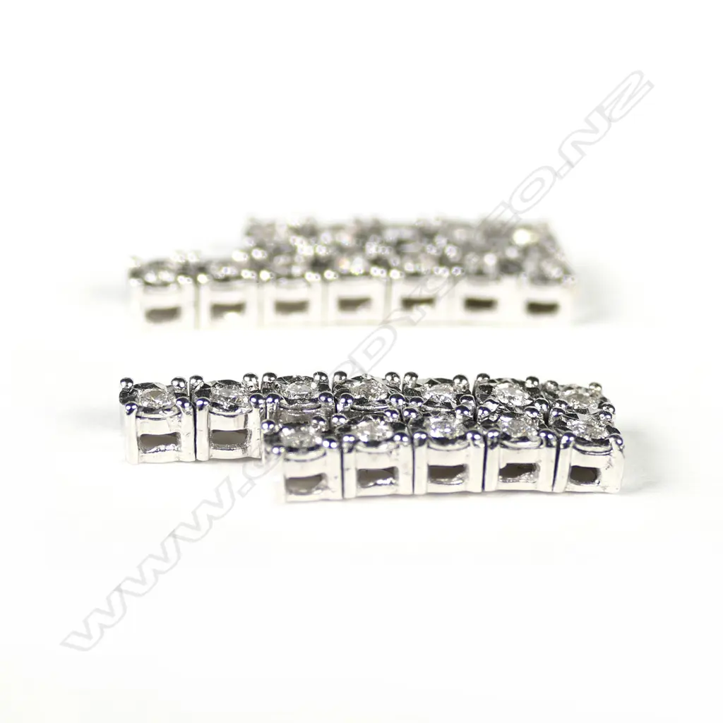 A pair of 14ct white gold and diamond earrings Image 1++