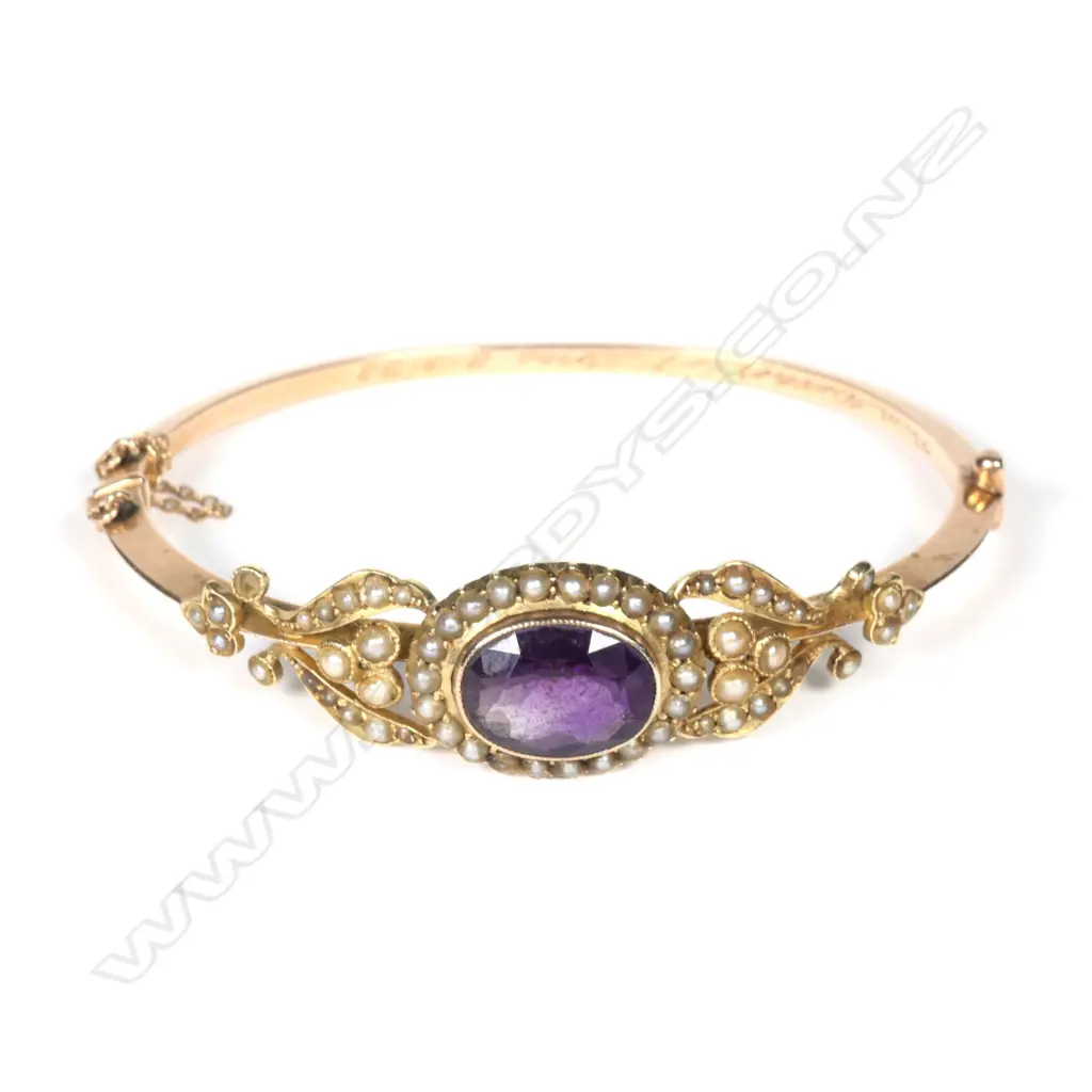 A Victorian gilded 15ct gold amethyst and seed pearl bangle Image 1++
