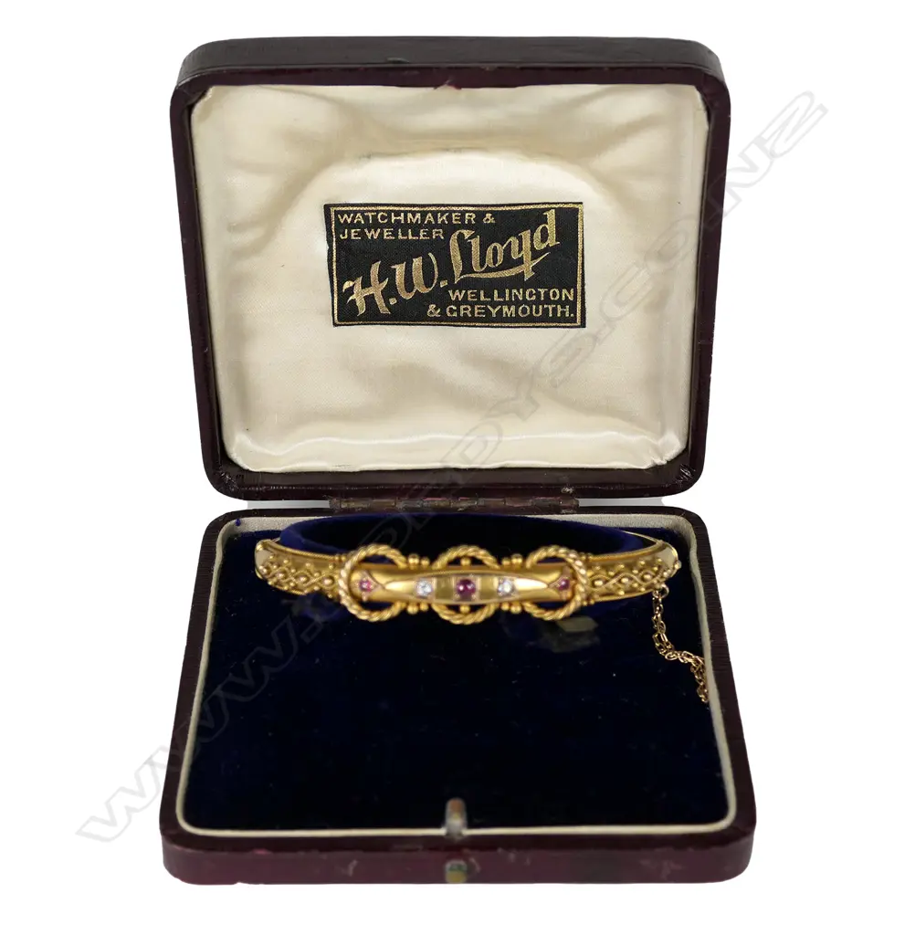 A good 15ct gilded yellow gold ruby and diamond hinged bangle Image 1++