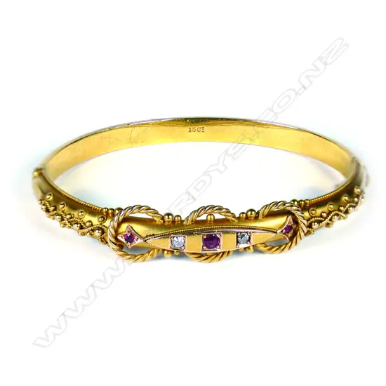 A good 15ct gilded yellow gold ruby and diamond hinged bangle