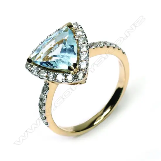 A 14ct yellow gold aquamarine and diamond halo ring