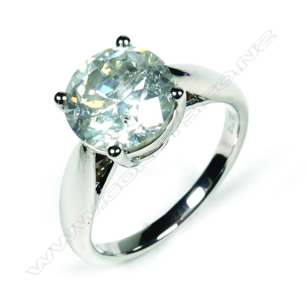 A 14ct white gold and diamond solitaire ring Image 1++