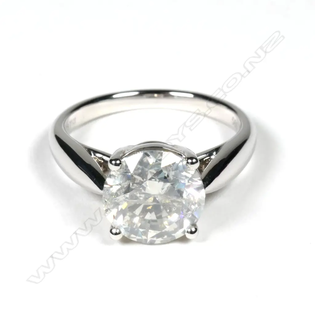 A 14ct white gold and diamond solitaire ring Image 1++