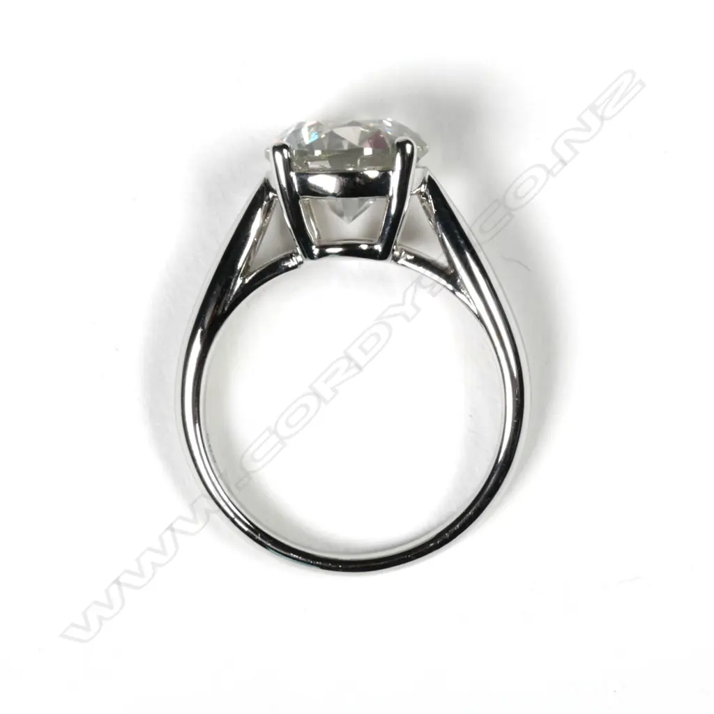 A 14ct white gold and diamond solitaire ring Image 1++