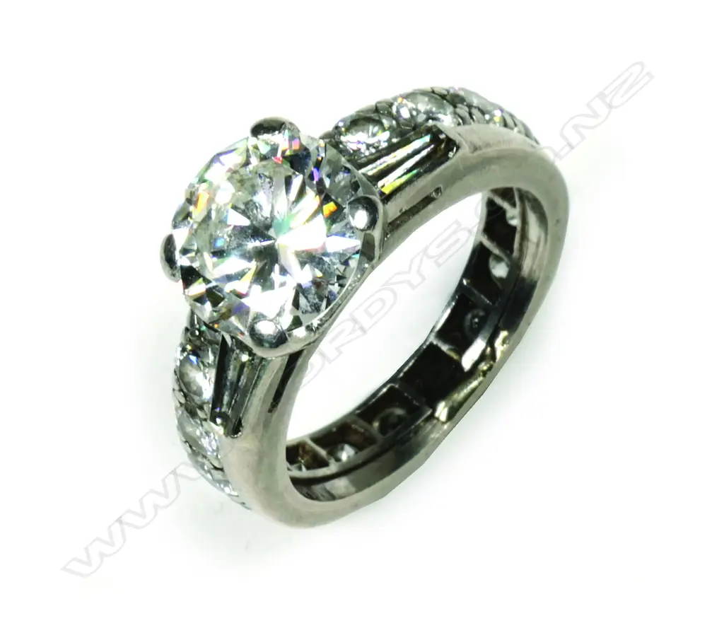 A 2ct diamond solitaire ring together with joined companion eternity band Image 1++