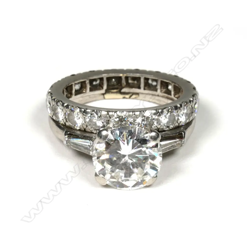 A 2ct diamond solitaire ring together with joined companion eternity band Image 1++