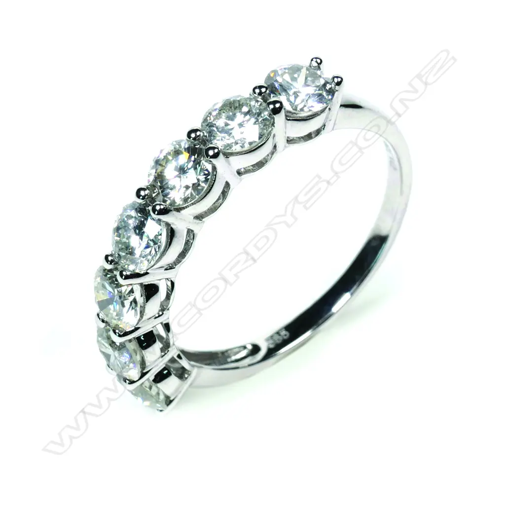 A 14ct white gold seven stone diamond ring Image 1++