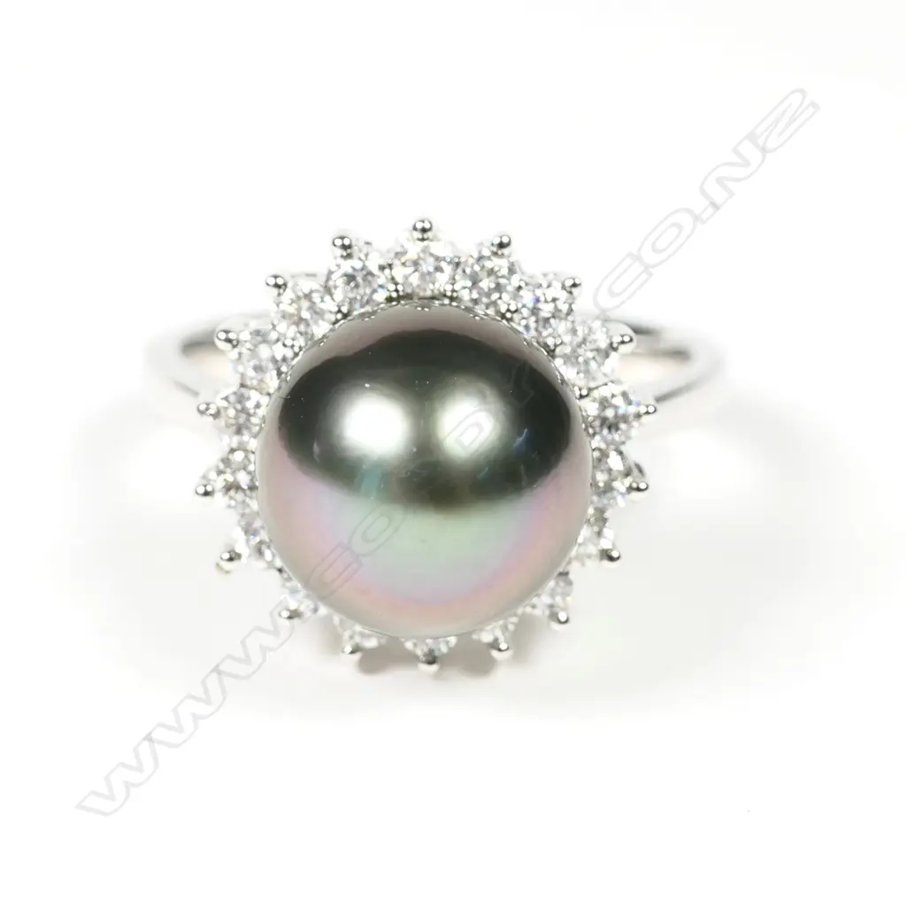 A modern 18ct white gold pearl and diamond ring Image 1++