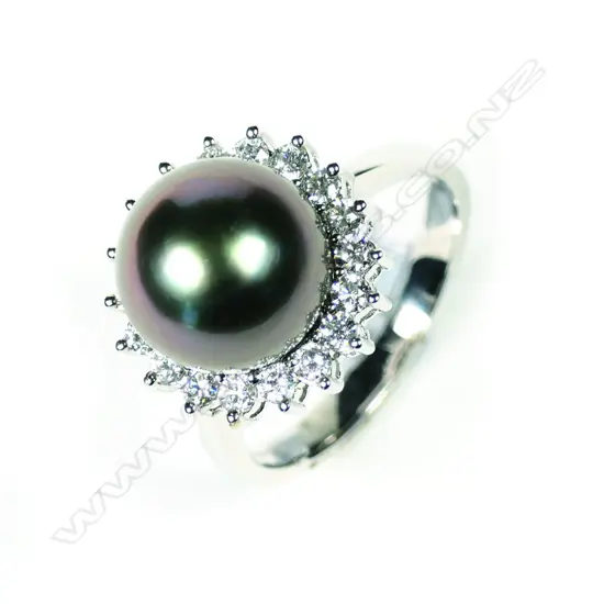 A modern 18ct white gold pearl and diamond ring