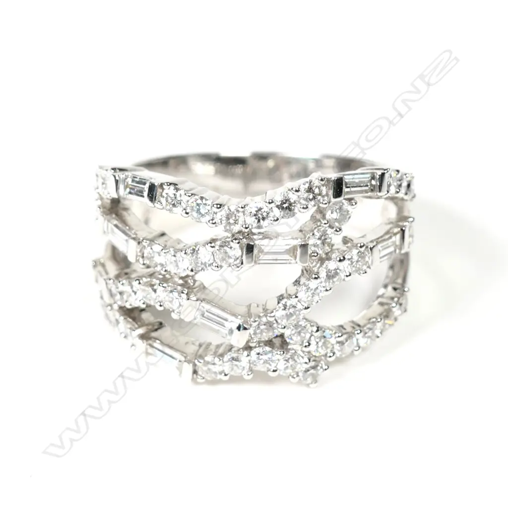 A modern 18ct white gold and multi diamond wide band ring Image 1++