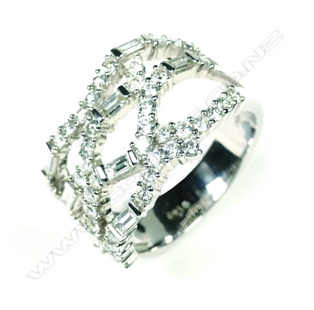 A modern 18ct white gold and multi diamond wide band ring Image 1++