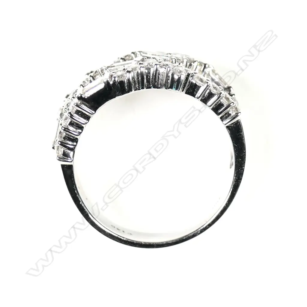 A modern 18ct white gold and multi diamond wide band ring Image 1++