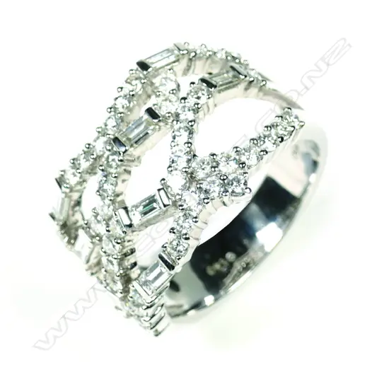 A modern 18ct white gold and multi diamond wide band ring