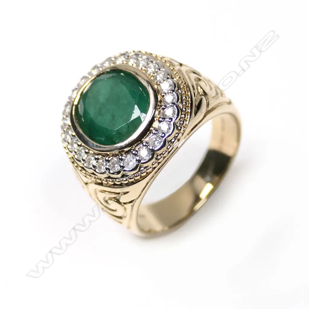 A 14ct gold emerald and diamond gent’s ring Image 1++