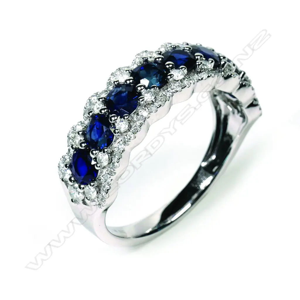 A 14ct white gold sapphire and diamond ring Image 1++