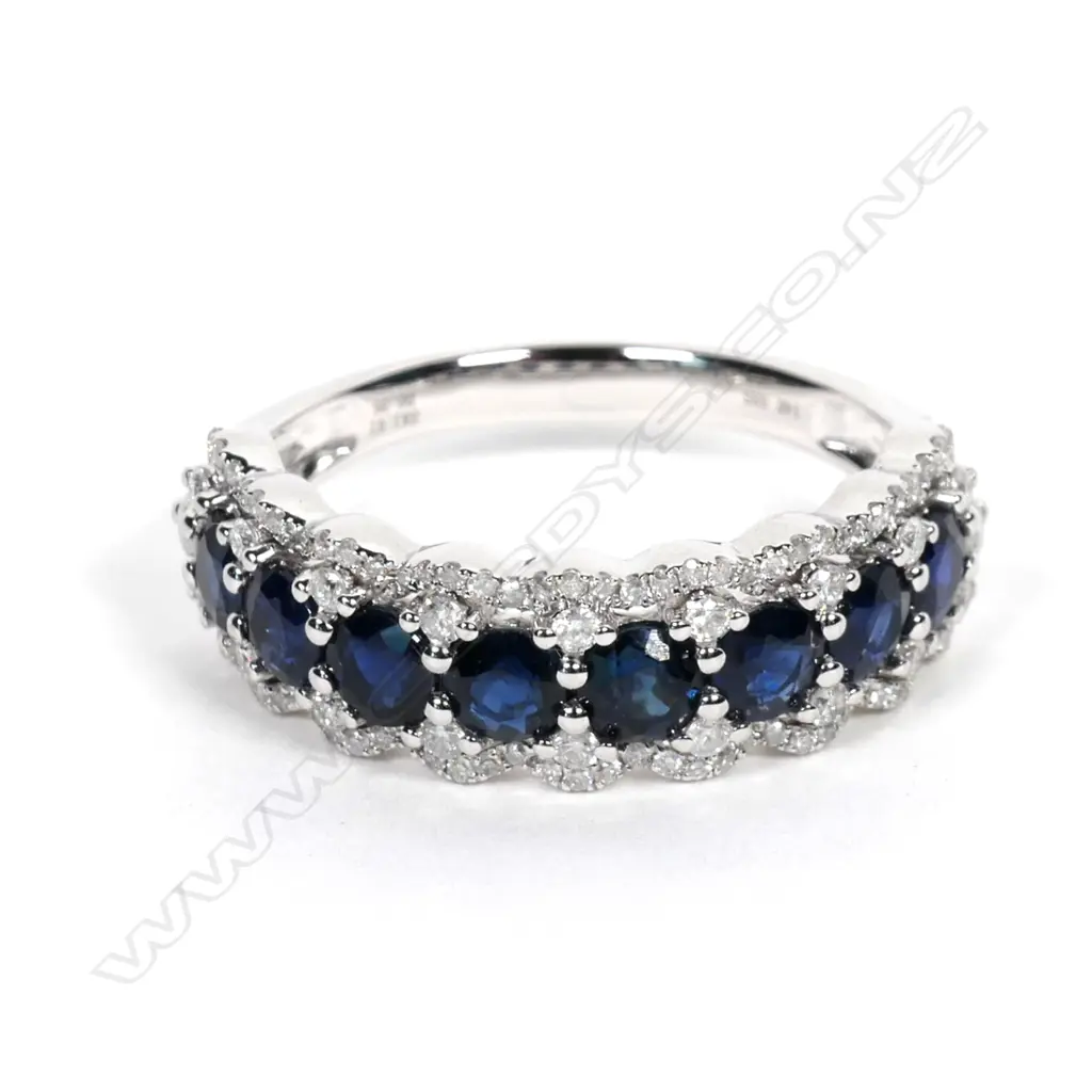 A 14ct white gold sapphire and diamond ring Image 1++