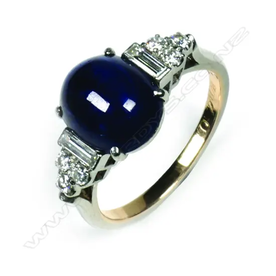 A vintage 14k cabochon blue sapphire and diamond ring