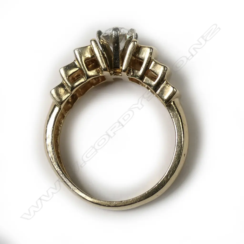 A stylish retro 14k gold and solitaire diamond ring Image 1++