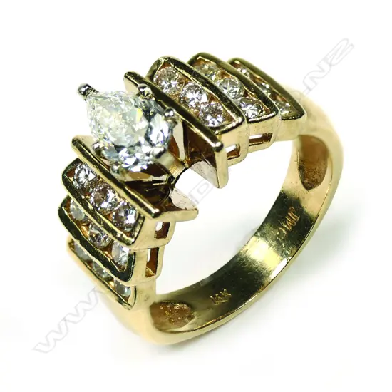 A stylish retro 14k gold and solitaire diamond ring