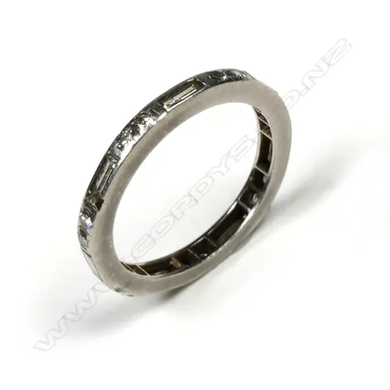 A vintage platinum and diamond eternity band ring