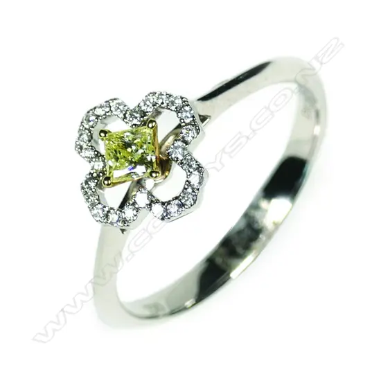 A 18ct white gold yellow and white diamond cluster ring