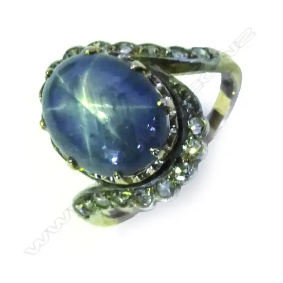 A vintage star sapphire and diamond estate cluster ring