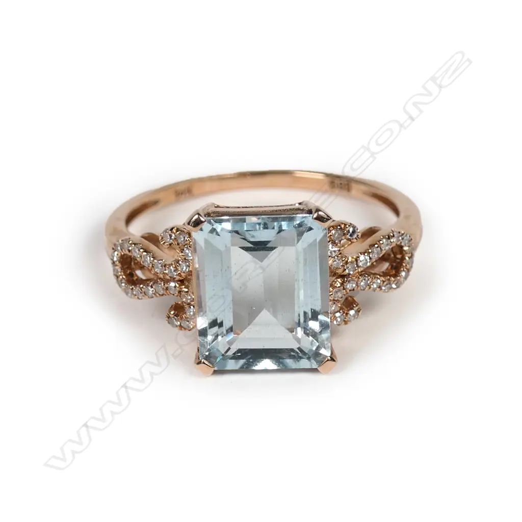 A 14k rose gold aquamarine and diamond ring Image 1++