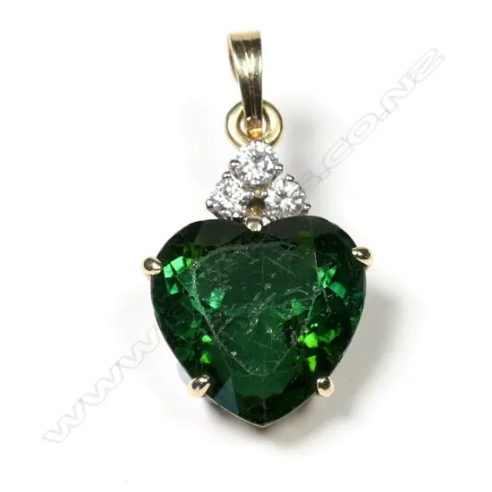 A 9ct green tourmaline and diamond pendant