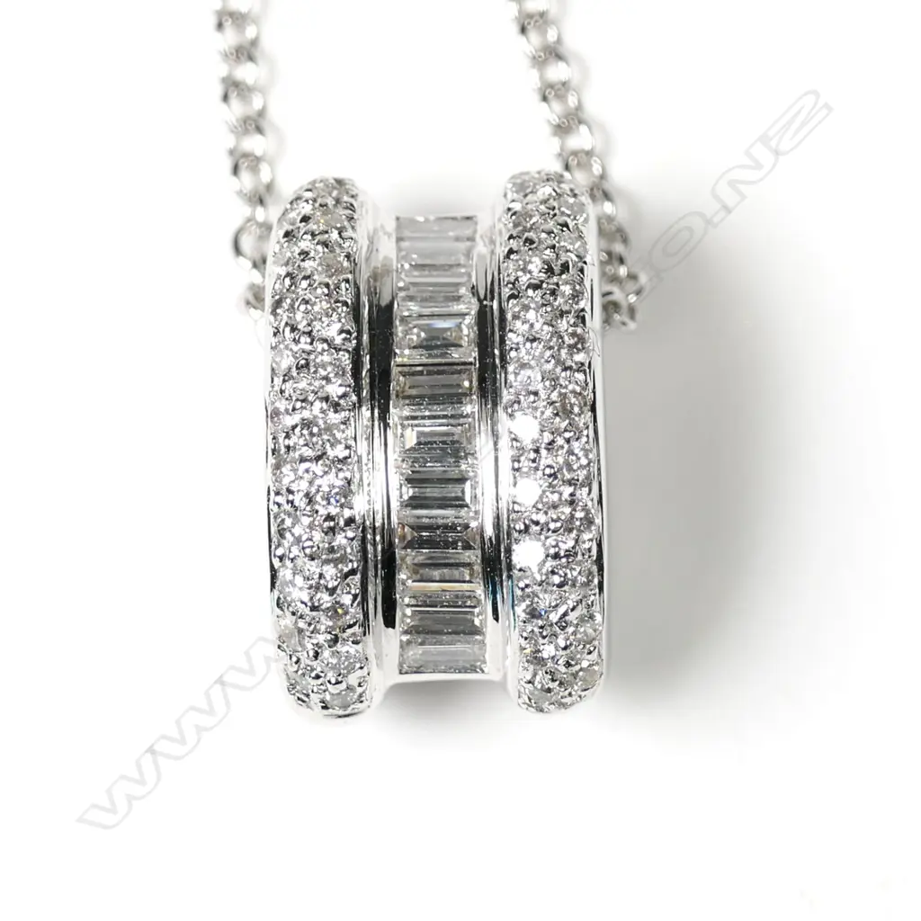 An 18ct white gold diamond pendant on chain Image 1++