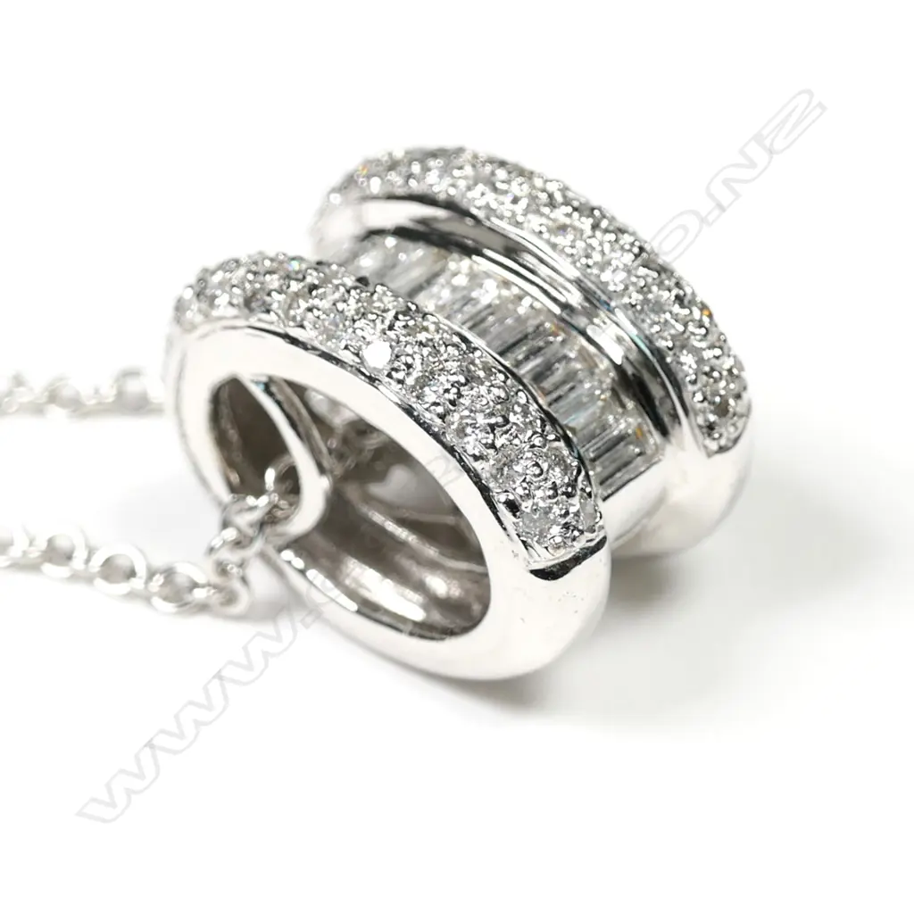 An 18ct white gold diamond pendant on chain Image 1++