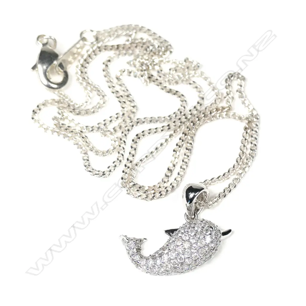 A 9ct white gold diamond set dolphin pendant Image 1++