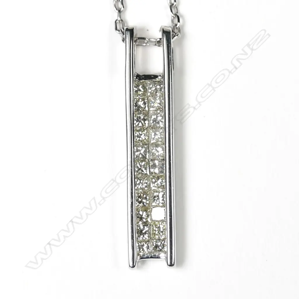 An 18k white gold and diamond set pendant Image 1++
