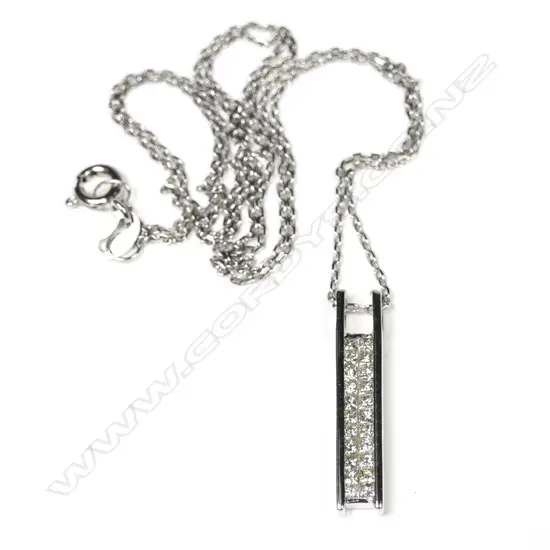 An 18k white gold and diamond set pendant